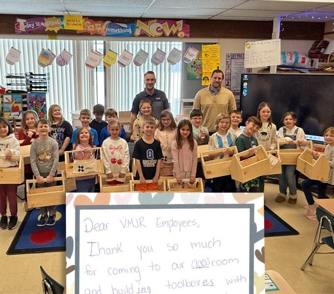 VMJR employees with school students and their toolboxes